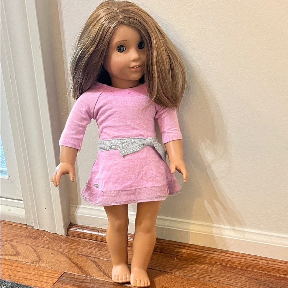 American Girl Doll- brown eyes, light brown straight hair.
